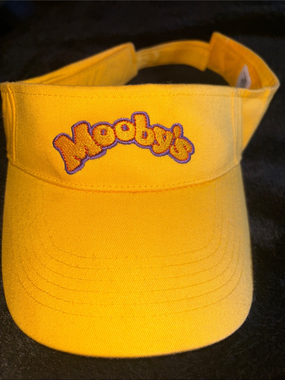 Mooby’s from Clerks movies, yellow visor, memorabilia.